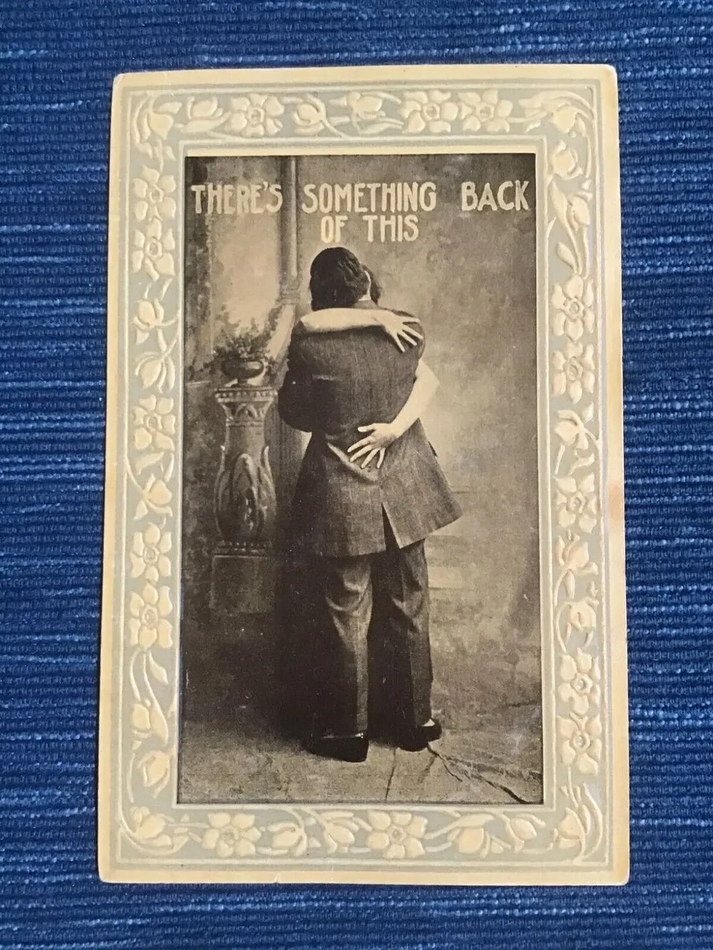 Vintage Postcard Embossed There's Something Back of This Love Couple Kiss
